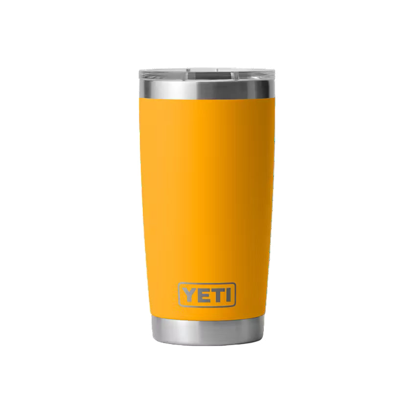 Yellow YETI tumbler with a black background